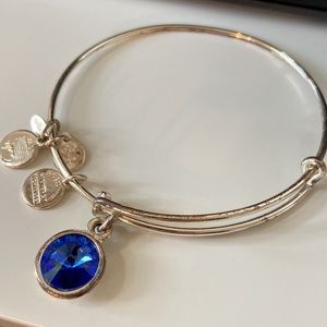Alex and Ani silver bracelet with sapphire charm
